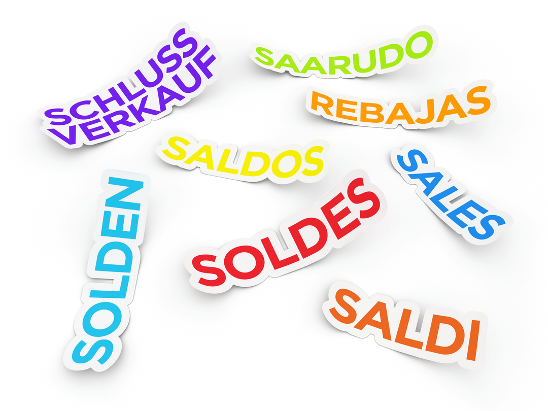 Colorful sale tags in different languages representing discounts for Baby Essentials Sale.