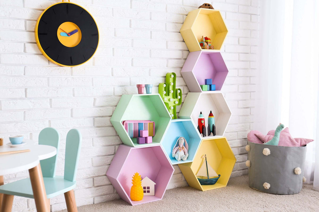 Stylish Baby and Nursery Storage Bins and Organizers displayed on a colorful hexagonal shelf in a bright room.