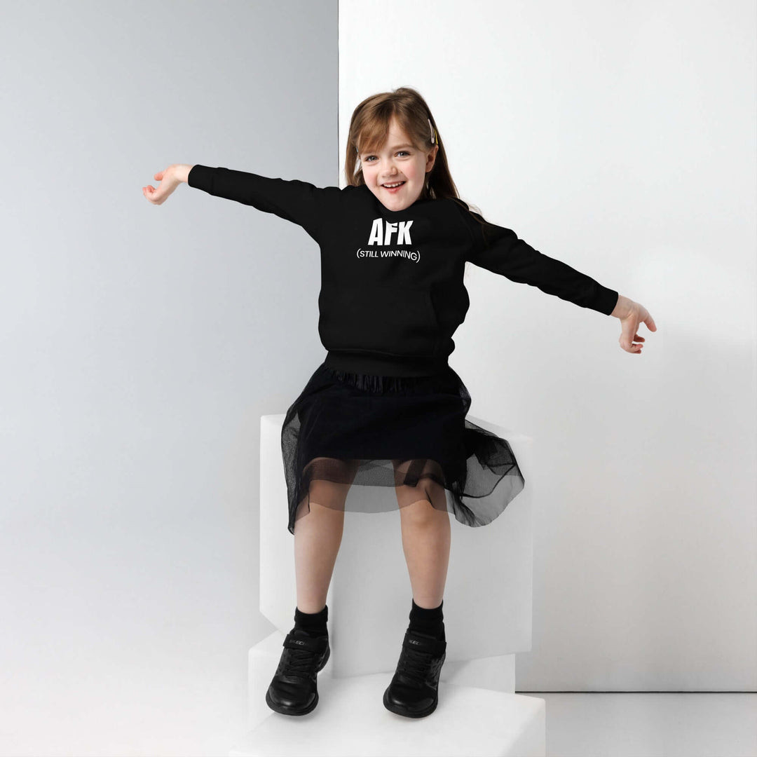 AFK Kids eco hoodie worn by a girl in a black outfit, showcasing comfort and style.