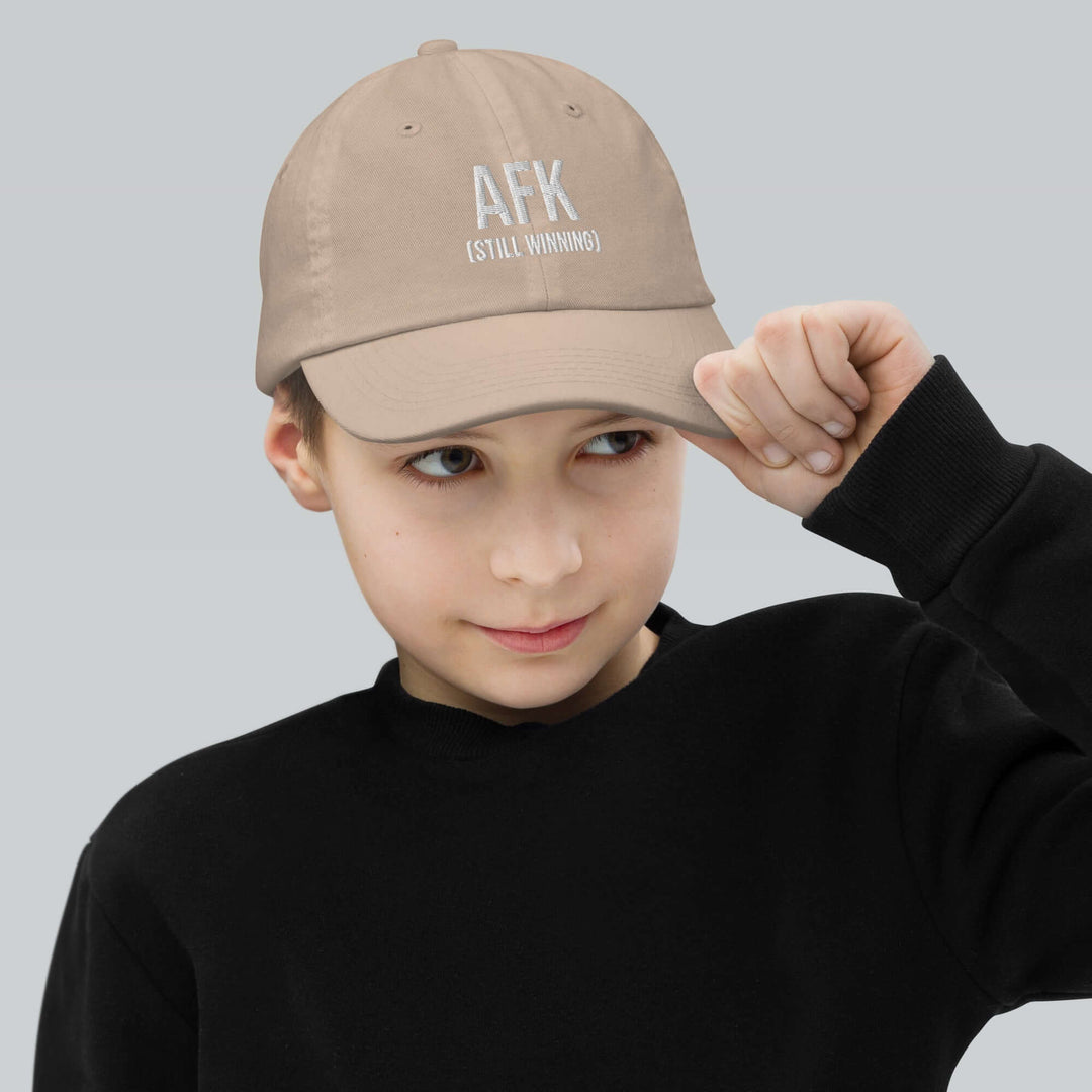 AFK Youth baseball cap worn by a boy in a black sweatshirt, perfect for training and style.