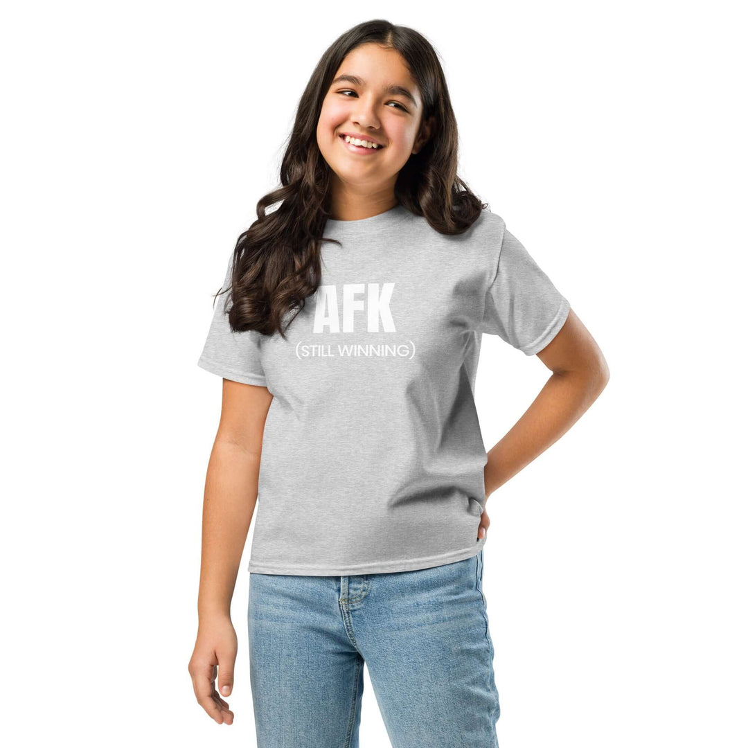 Girl wearing AFK Youth classic tee in Sport Grey, featuring a fun design saying 'AFK (STILL WINNING)'. Comfortable and stylish.