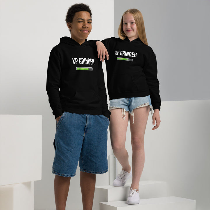 Two children wearing XP Grinder Youth heavy blend hoodies in black, showcasing comfort and style.